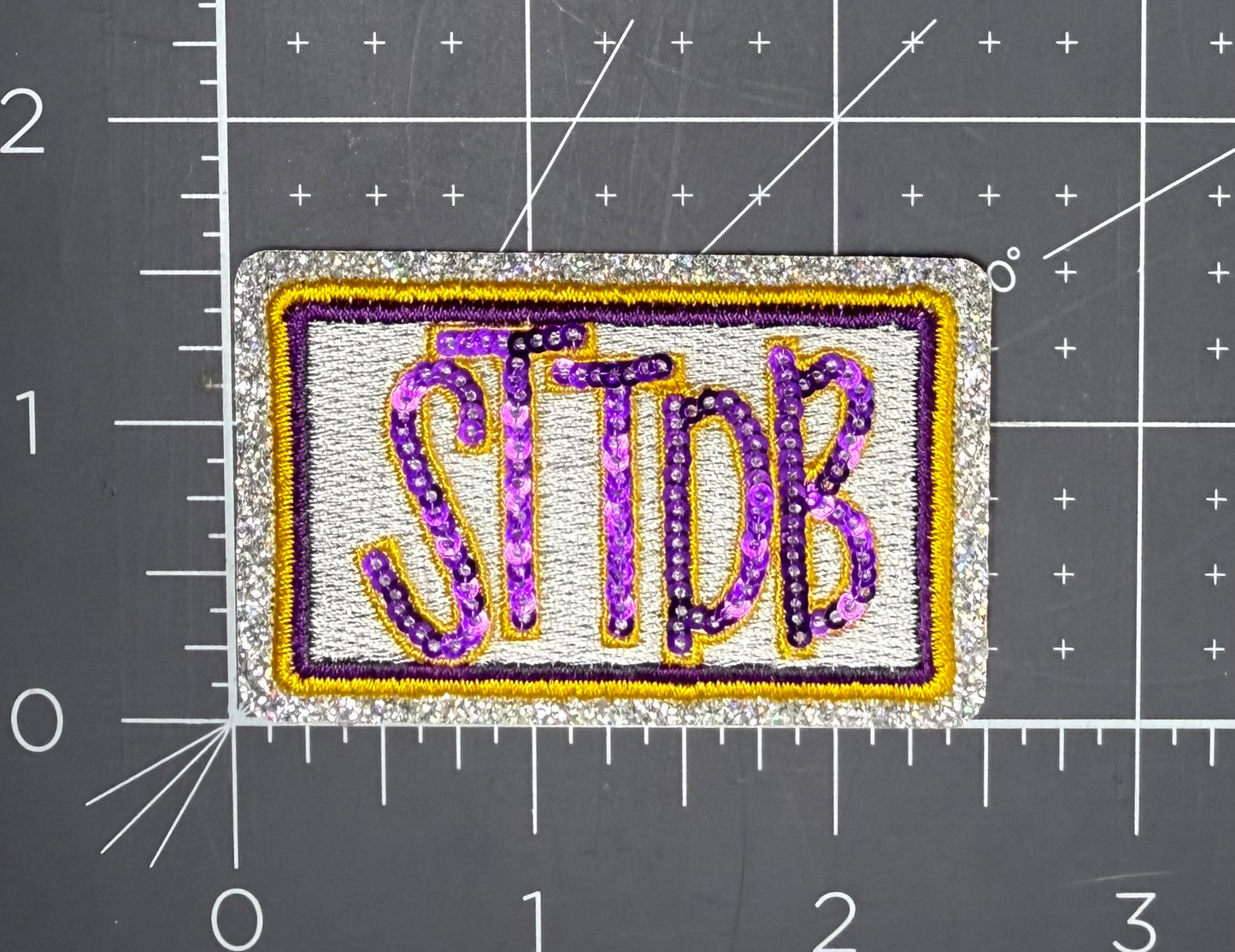 STTDB Purple & Gold Sequin Hat Patch | Game Day Iron-On Patch
